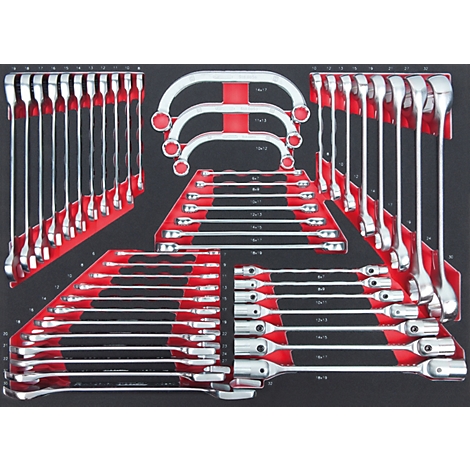 Verschiedene Schraubenschlüssel in roten Haltern auf schwarzem Grund angeordnet.